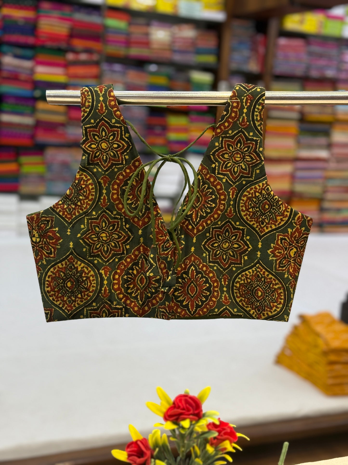 Back view of Green Ajrakh blouse featuring stylish tie-up detail and rich handcrafted patterns