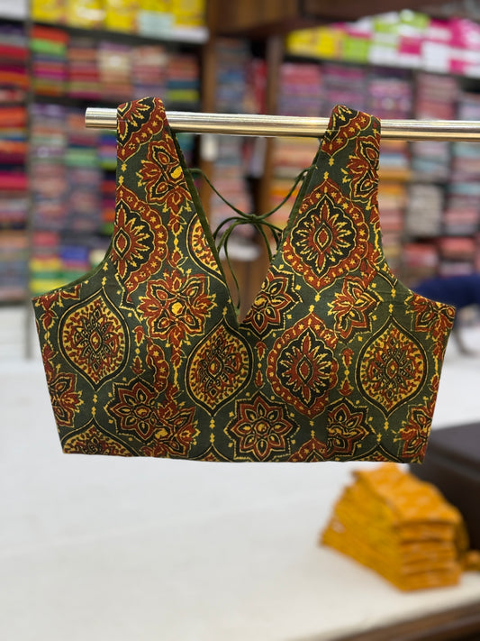 Green Ajrakh cotton blouse with deep V-neck and intricate block prints, handcrafted for ethnic styling.