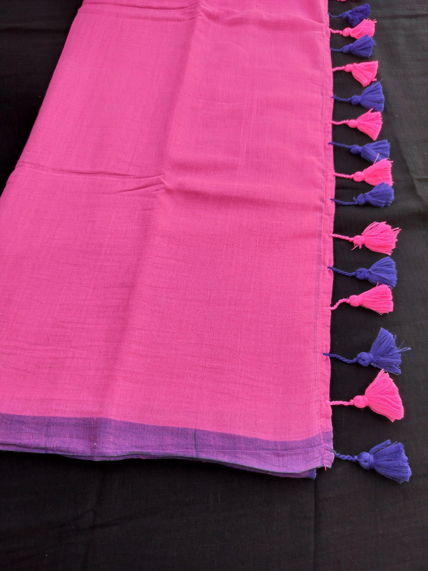 Pink Mulmul Saree With Pink & Blue Tassels.