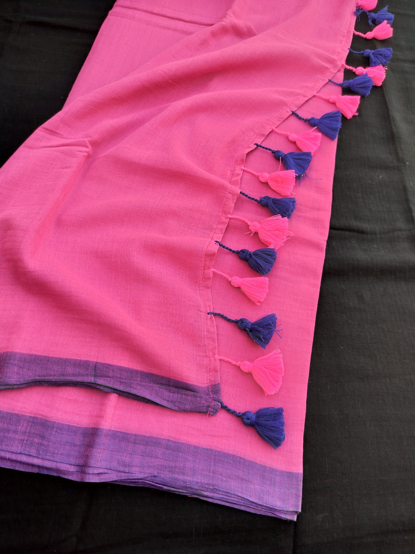 Pink Mulmul Saree With Pink & Blue Tassels.