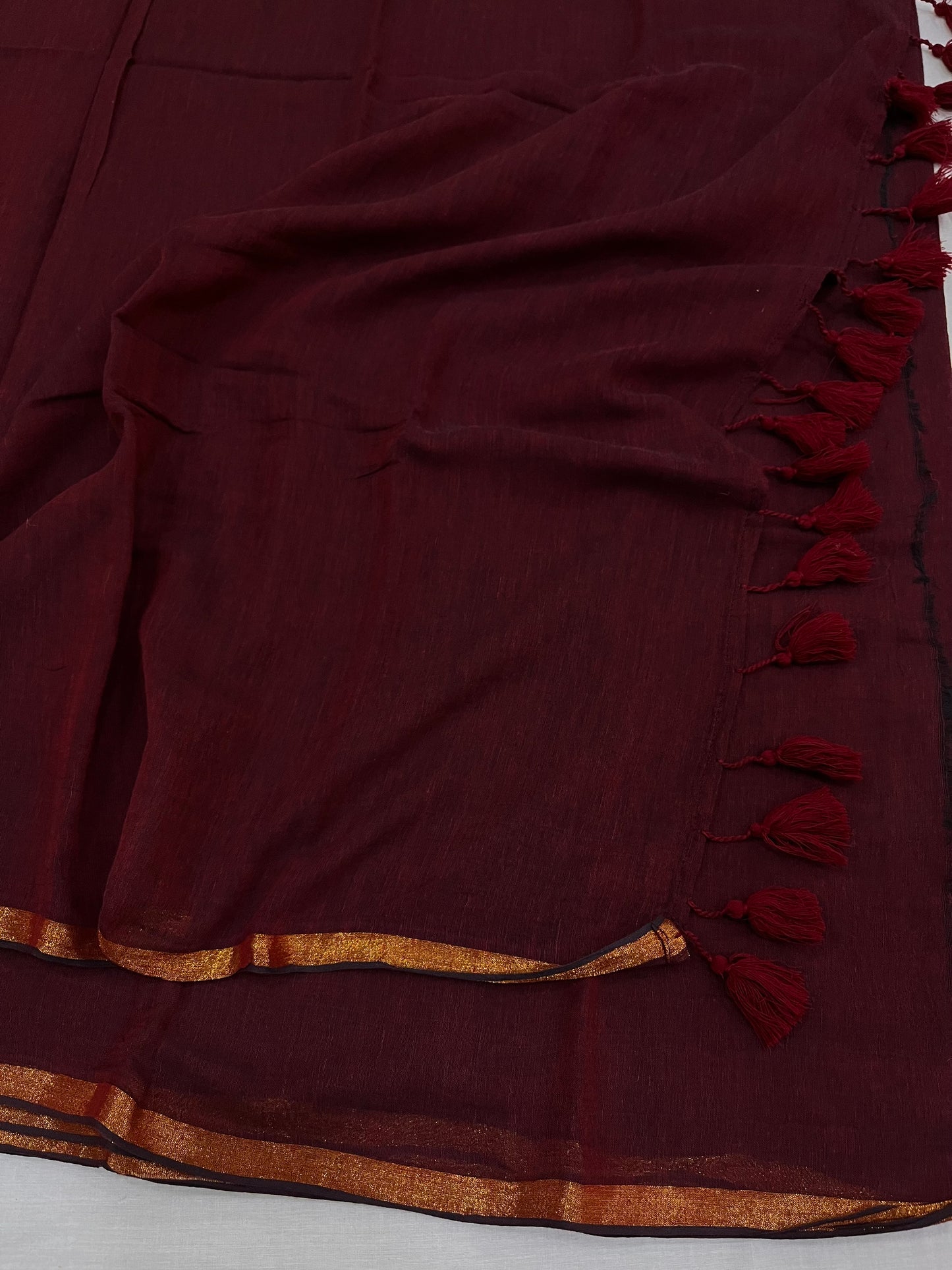 Maroon Copper Zari Border Mulmul Saree